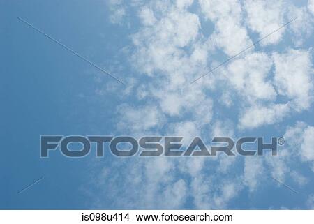 Picture - Blue sky and fluffy clouds. Fotosearch