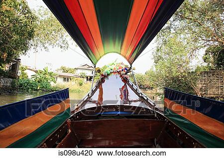 Stock Image - Boat on canal in bangkok. Fotosearch