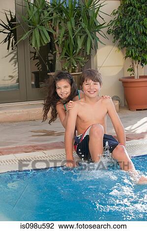 Brother and sister at the pool View Large Photo Image Stock Image - Brother and sister at the pool. Fotosearch