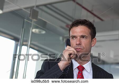 Businessman on phone View Large Photo Image Stock Photography - Businessman on phone. Fotosearch