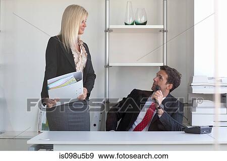Businessman talks to employee View Large Photo Image Stock Photo - Businessman talks to employee. Fotosearch