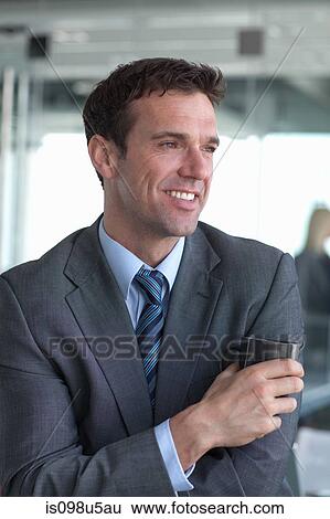 Stock Photograph - Businessman with coffee. Fotosearch