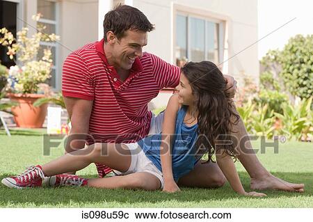 Father and daughter in the garden View Large Photo Image Stock Image - Father and daughter in the garden. Fotosearch