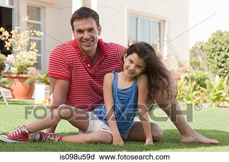 Father and daughter in the garden View Large Photo Image Stock Image - Father and daughter in the garden. Fotosearch
