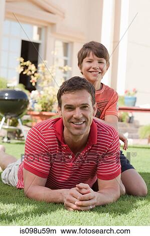 Father and son in the garden View Large Photo Image Picture - Father and son in the garden. Fotosearch
