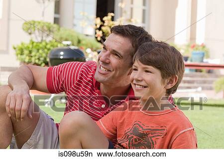 Father and son in the garden View Large Photo Image Picture - Father and son in the garden. Fotosearch