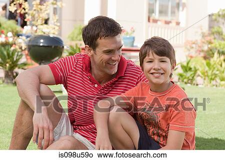 Father and son in the garden View Large Photo Image Picture - Father and son in the garden. Fotosearch