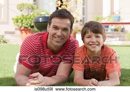 Stock Image - Father and son in the garden. Fotosearch