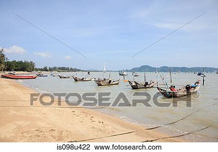 Stock Image - Fishing boats near chalong bay, phuket, thailand. Fotosearch