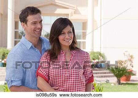 Happy couple in garden View Large Photo Image Stock Photograph - Happy couple in garden. Fotosearch