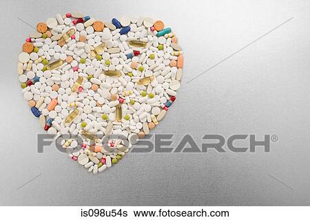 Stock Photograph - Heart shape made from pills. Fotosearch