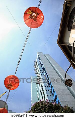 Stock Image - Lanterns and high rise in singapore china town. Fotosearch