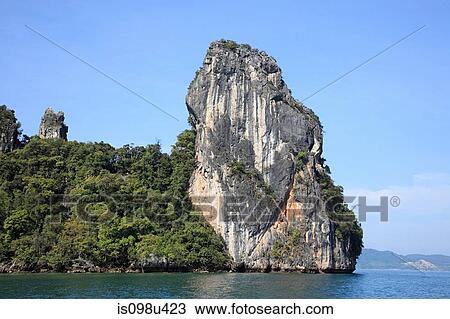Stock Image - Limestone outcrop in phuket sea. Fotosearch