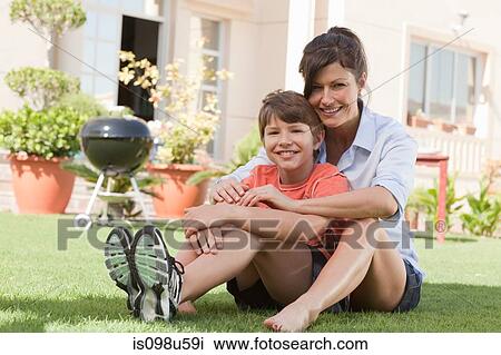 Mother and son in the garden View Large Photo Image Stock Image - Mother and son in the garden. Fotosearch
