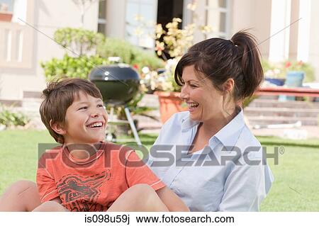 Mother and son in the garden View Large Photo Image Stock Image - Mother and son in the garden. Fotosearch