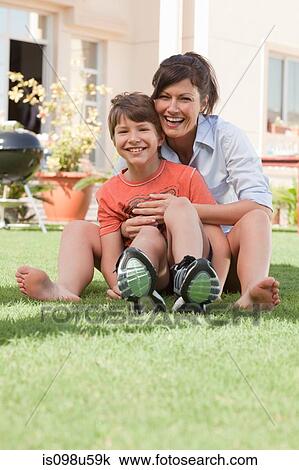 Stock Image - Mother and son in the garden. Fotosearch