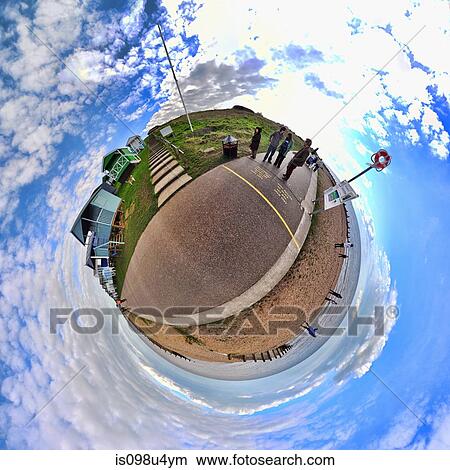 People at the seaside with little planet effect View Large Photo Image Picture - People at the seaside with little planet effect. Fotosearch