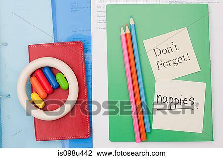 Stock Image - Reminder notes on parent's notebook. Fotosearch