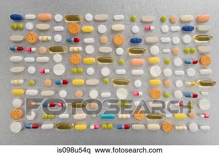 Rows of pills on grey background View Large Photo Image Stock Photography - Rows of pills on grey background. Fotosearch