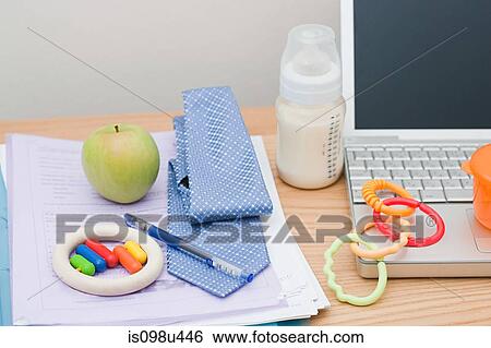 Tie, laptop and baby equipment on desk View Large Photo Image Stock Photograph - Tie, laptop and baby equipment on desk. Fotosearch