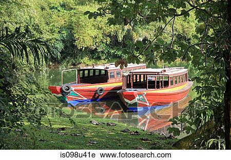 Tourist boats on lake in singapore View Large Photo Image Stock Image - Tourist boats on lake in singapore. Fotosearch