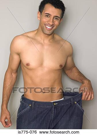 Man with loose jeans View Large Photo Image Stock Photograph - Man with loose jeans. Fotosearch