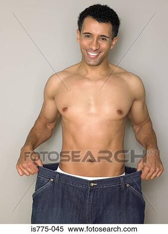 Stock Photography - Man with loose jeans. Fotosearch