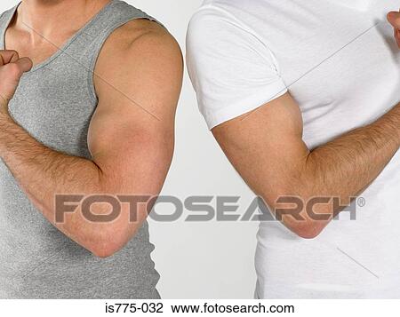 Stock Image - Men flexing muscles. Fotosearch