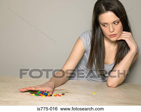 Young woman with sweets View Large Photo Image Stock Photograph - Young woman with sweets. Fotosearch