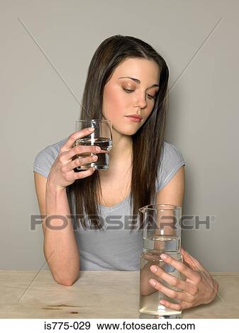 Young woman with water View Large Photo Image Stock Photo - Young woman with water. Fotosearch