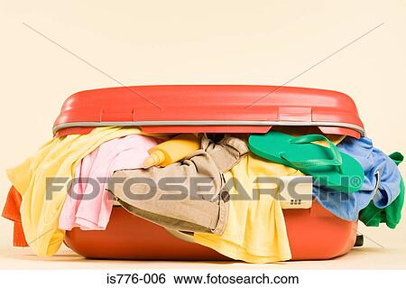 Stock Photograph - Clothes in a suitcase. Fotosearch