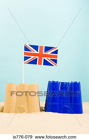 Stock Photo - Sandcastle with british flag. Fotosearch