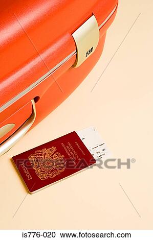 Stock Image - Suitcase passport and ticket. Fotosearch