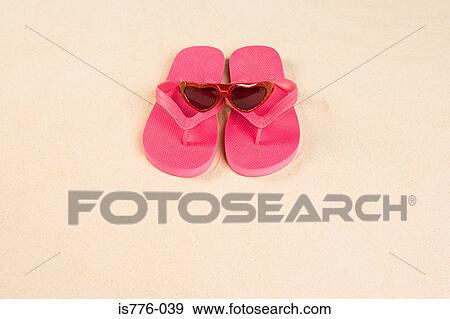Sunglasses and flip flops View Large Photo Image Stock Photo - Sunglasses and flip flops. Fotosearch