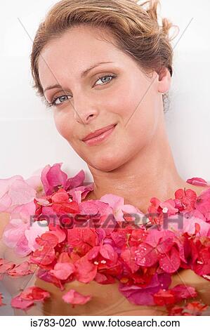 Woman in a bath with petals View Large Photo Image Stock Image - Woman in a bath with petals. Fotosearch