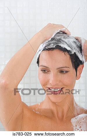 Woman shampooing her hair View Large Photo Image Stock Photography - Woman shampooing her hair. Fotosearch