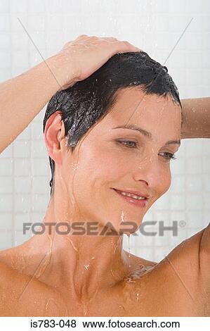 Woman showering View Large Photo Image Stock Photo - Woman showering. Fotosearch