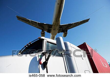 Truck and a plane View Large Photo Image Stock Photo - Truck and a plane. Fotosearch