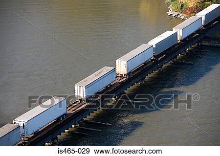 Stock Photo - Truck trailers on a cargo container. Fotosearch