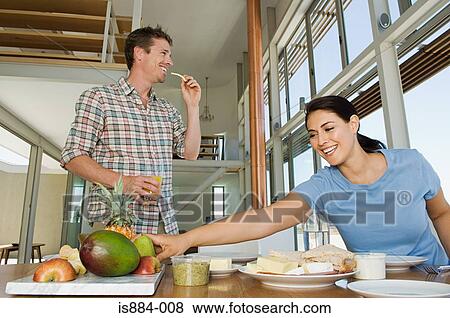 Stock Photo - Couple having food. Fotosearch