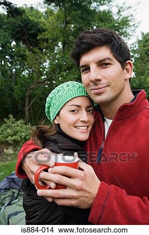 Picture - Couple keeping warm. Fotosearch