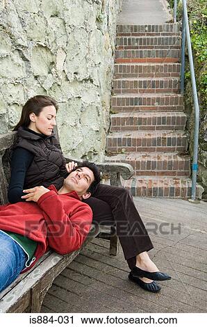 Couple on a bench View Large Photo Image Stock Image - Couple on a bench. Fotosearch