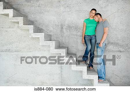Couple on stairs with eyes closed View Large Photo Image Stock Image - Couple on stairs with eyes closed. Fotosearch