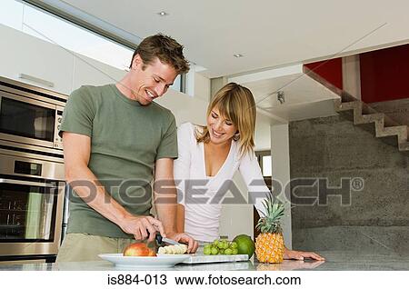 Couple preparing fruit View Large Photo Image Stock Image - Couple preparing fruit. Fotosearch