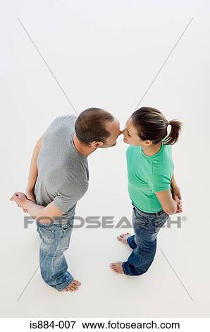 Stock Photo - Couple touching noses. Fotosearch