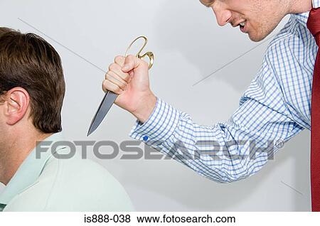 Man stabbing colleague in back View Large Photo Image Stock Photo - Man stabbing colleague in back. Fotosearch