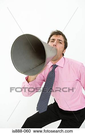 Stock Image - Man using megaphone. Fotosearch