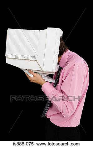 Stock Photography - Man with head inside computer monitor. Fotosearch