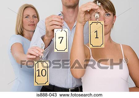 People holding hotel keys View Large Photo Image Stock Image - People holding hotel keys. Fotosearch