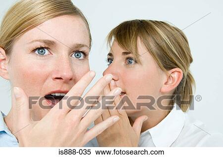 Stock Photography - Two women gossiping. Fotosearch